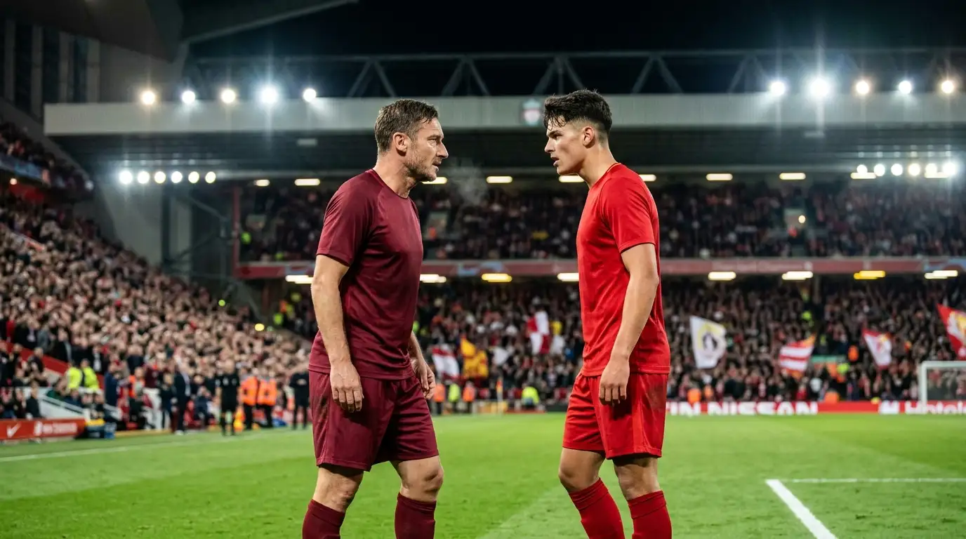 Dvaja futbalisti v červenom a v tmavočervenom drese pred sebou na osvetlenom štadióne pred začiatkom veľkého zápasu
